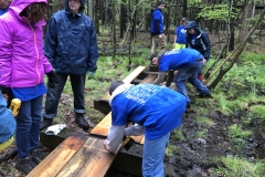 Puncheon Crew repairing a bridge on a trail behind the HNC
